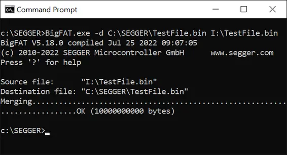 The image displays a Command Prompt window showing the execution of a BigFAT tool. It indicates a merging operation from a source file ("I:\TestFile.bin") to a destination file ("C:\SEGGER\TestFile.bin") with a successful completion message of "OK (1000000000 bytes)."