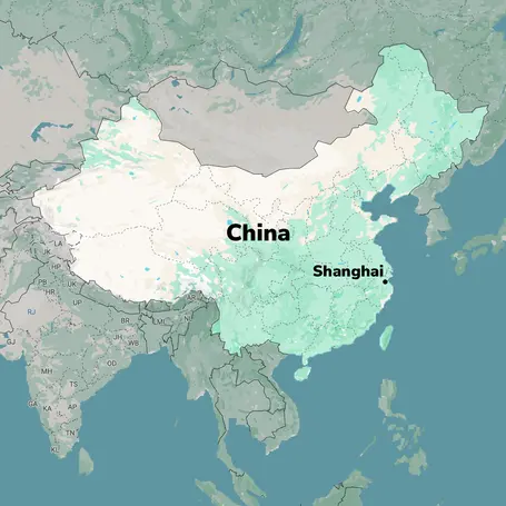 A map of China highlighting the geographic region, with "China" and "Shanghai" clearly labeled. The area shows varying shades of green, indicating different terrains, while the surrounding regions, such as parts of India and Southeast Asia, are lightly depicted.