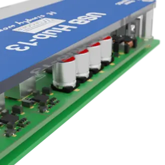 A USB hub with a blue top, labeled "USB Hub-13," features several metallic components and capacitors on a green circuit board. The design suggests it is intended for connecting multiple USB devices.