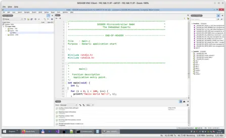 A computer screen displays a code editor with the C programming language. The visible code includes the standard input/output library and a main function that features a loop printing "Hello World" followed by an integer from 0 to 99. Output and project information are also shown.