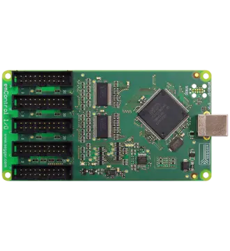 A green printed circuit board featuring multiple electronic components, including a central microcontroller chip and several connectors. It has five rows of connectors on one side and a USB port on the opposite edge, used for connecting to other devices.