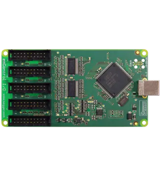 A green printed circuit board featuring multiple electronic components, including a central microcontroller chip and several connectors. It has five rows of connectors on one side and a USB port on the opposite edge, used for connecting to other devices.
