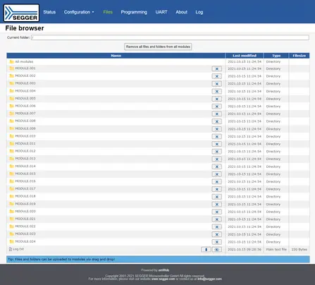 A file browser interface displaying various modules listed in a directory format. Each module is labeled with a name like "MODULE.001" through "MODULE.024," along with a timestamp for last modification and directory designation. A tip about file uploads via drag and drop is also visible.