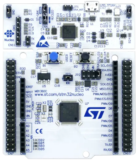 Image of a Nucleo development board featuring various connectors, buttons, and an integrated circuit chip. The board's layout includes labeled pins and components, designed for microcontroller prototyping, highlighting its application in electronics and programming projects.