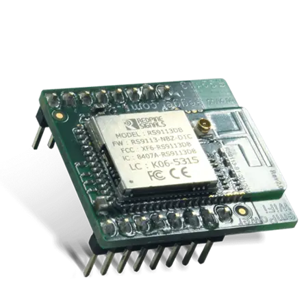 Image of a compact circuit board with a central chip and multiple pins along one edge. The board is labeled with model and certification information, including "RS9113DB." It is designed for electronic projects and devices, showcasing its utility in wireless communication applications.