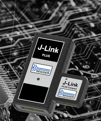 Two SEGGER J-Link devices are displayed: the larger J-Link Plus and the smaller J-Link Plus Compact, both featuring prominent logos. They are set against a background of circuit board patterns, illustrating their application in electronics development and debugging.