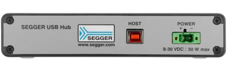 Image of a SEGGER USB Hub's rear panel, featuring a "HOST" connection port, a power input labeled with voltage specifications (8-30 VDC), and a branding logo. The design is metallic gray with black edges, primarily focused on connectivity options.