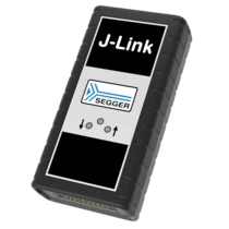 Image of a J-Link debugging device from SEGGER. The device has a rectangular shape with a black casing and a silver panel featuring the "J-Link" logo and SEGGER branding. It includes several buttons and indicators for user interaction.