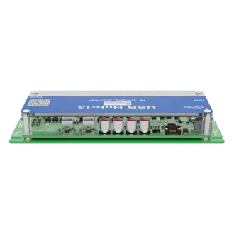 A USB hub labeled "USB H-U-B-13" with a blue top and multiple ports is shown. The circuit board features several components, including four round connectors, small chips, and a power input. The design is compact and intended for connecting multiple USB devices.