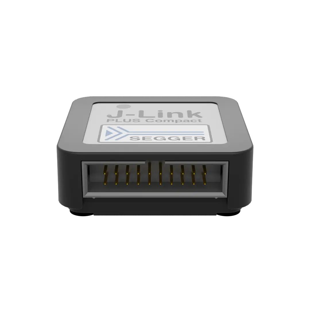 A compact black electronic device with a clearly labeled top featuring the text "J-Link PLUS Compact" and the SEGGER logo. The front side shows a row of metal pins, indicating its connection interface.