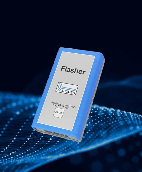 A blue and gray in-circuit programmer labeled "Flasher" is displayed. It features a logo for SEGGER and indicators for "Ready," "Not ready," and "Fail" status. The device is used for programming electronic circuits. The background has a digital design.