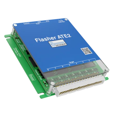 The image features the Segger Flasher ATE2, a programming and debugging device. It has a blue top with labeled ports for control and power, mounted on a green base with connectors for various electronic targets. The device is designed for efficient programming of embedded systems.