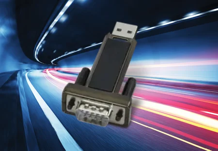 A USB device is prominently displayed against a blurred background of dynamic light streaks, suggesting speed. The device features a standard USB connector at one end and a serial connector at the other, indicating its utility in data transfer or communication.