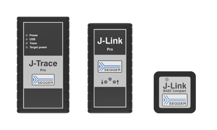 Three electronics devices from SEGGER are displayed: on the left is the J-Trace Pro, in the middle is the J-Link Pro, and on the right is the J-Link BASE Compact. Each device features a main label with icons indicating power, USB, trace, and target features.