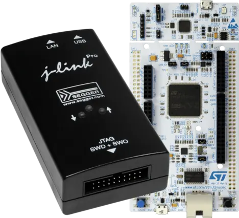 The image features a black J-Link Pro debugging tool, labeled with buttons for LAN and USB connections, positioned next to a detailed microcontroller development board. The board showcases various electronic components and pin connectors, designed for programming and debugging applications.