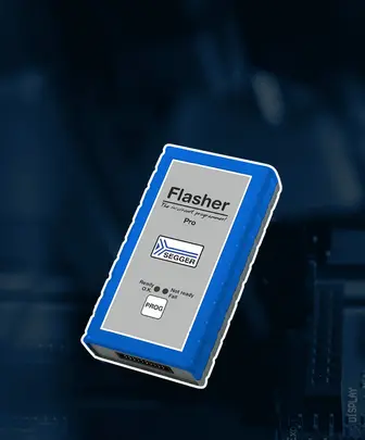 A blue rectangular programming device labeled "Flasher Pro" with the SEGGER logo. The front features indicators for "Ready," "Not ready," and "Fail," along with a "PROG" button. This device is used for embedded programming.