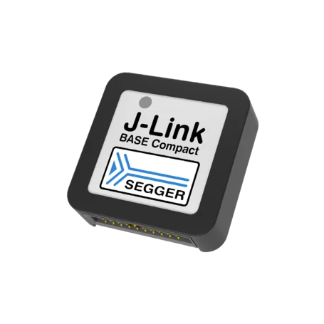 A compact black device labeled "J-Link BASE Compact" with the SEGGER logo. The top features a white background with text and a blue design element. The device has connection pins on one side, suggesting it is used for electronic interfacing or programming.